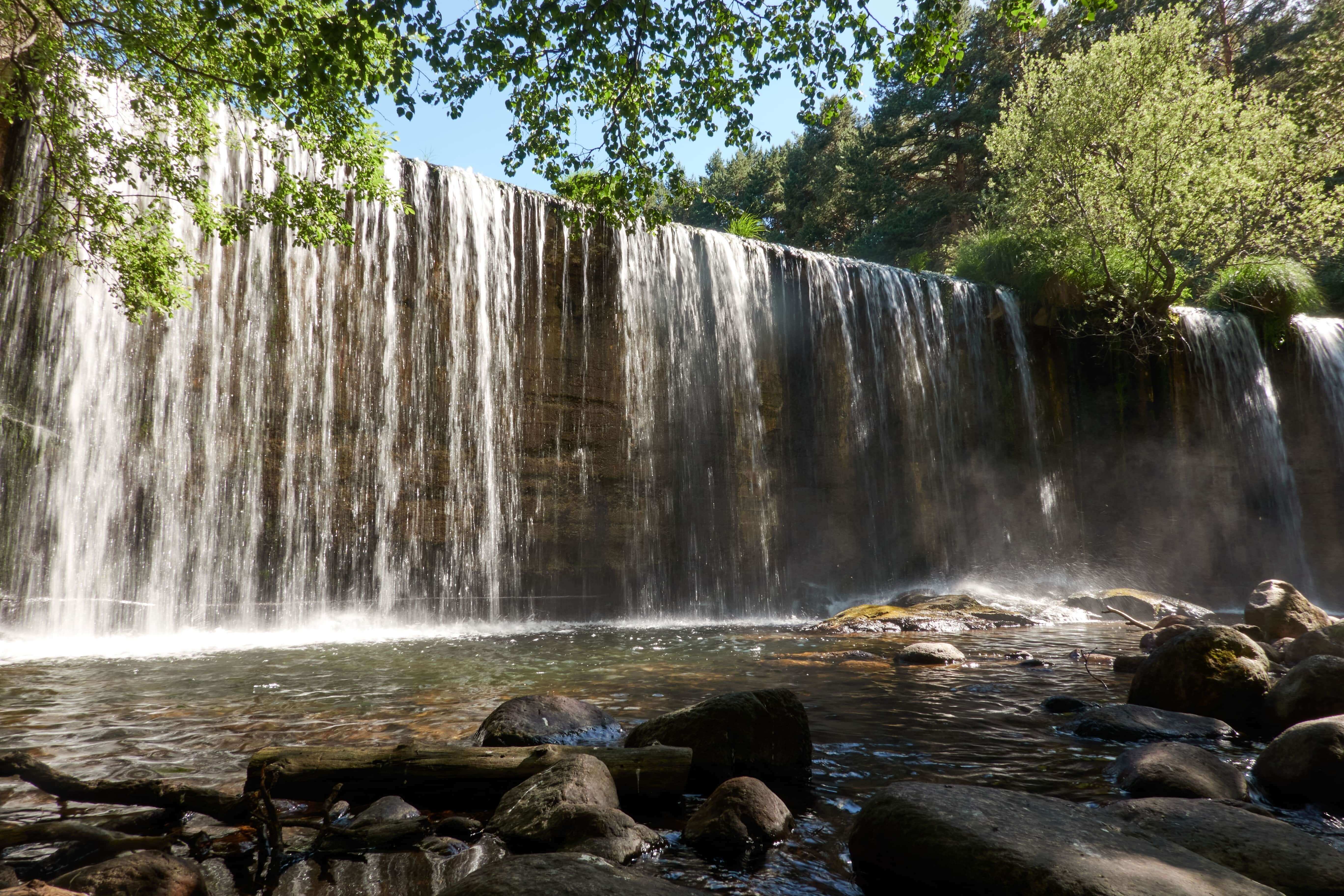 Pradillo Dam waterfall in the Sierra de Guadarrama National Park. Lozoya Valley. Madrid's community. Spain